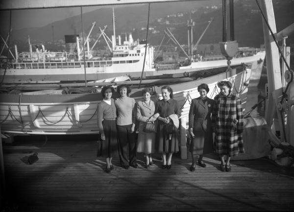 Women gathered in front of ship