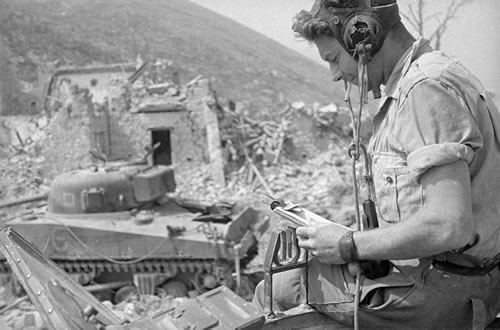 Signaller at work among the ruins of Cassino