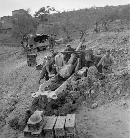 Soldiers winching artillery gun