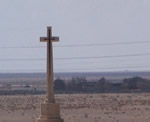 Cross  with desert in background