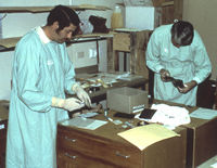 Two men in in coats in 
        laboratory