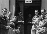 Soldiers pose outside sergeants' mess