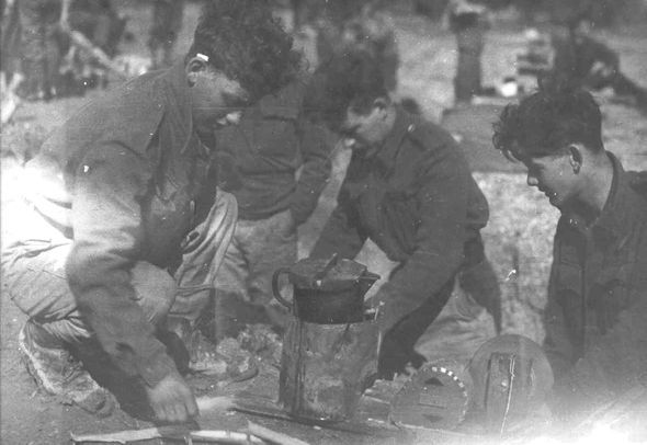 Soldiers cooking on blower