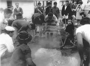 people preparing a hangi