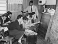 teacher standing at front of classroom