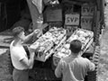 Unloading vegetables at US camp