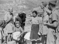 New Zealand soldiers talk to Italian refugees