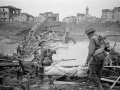 NZ soldiers crossing destroyed Italian bridge