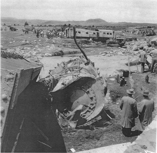 Fallen bridge span and locomotive, 25 December 1953 (45K)