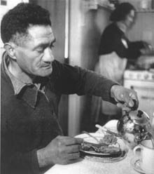 Man eating Toheroa fritters 