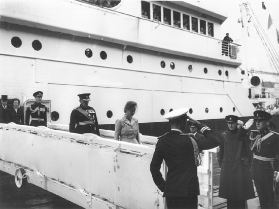 Naval salutes as Governor General  and his wife disembarks ship