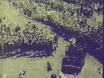 Queen waves to cheering children from car