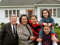 Family in front of State House