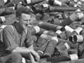 Soldier on pile of shells